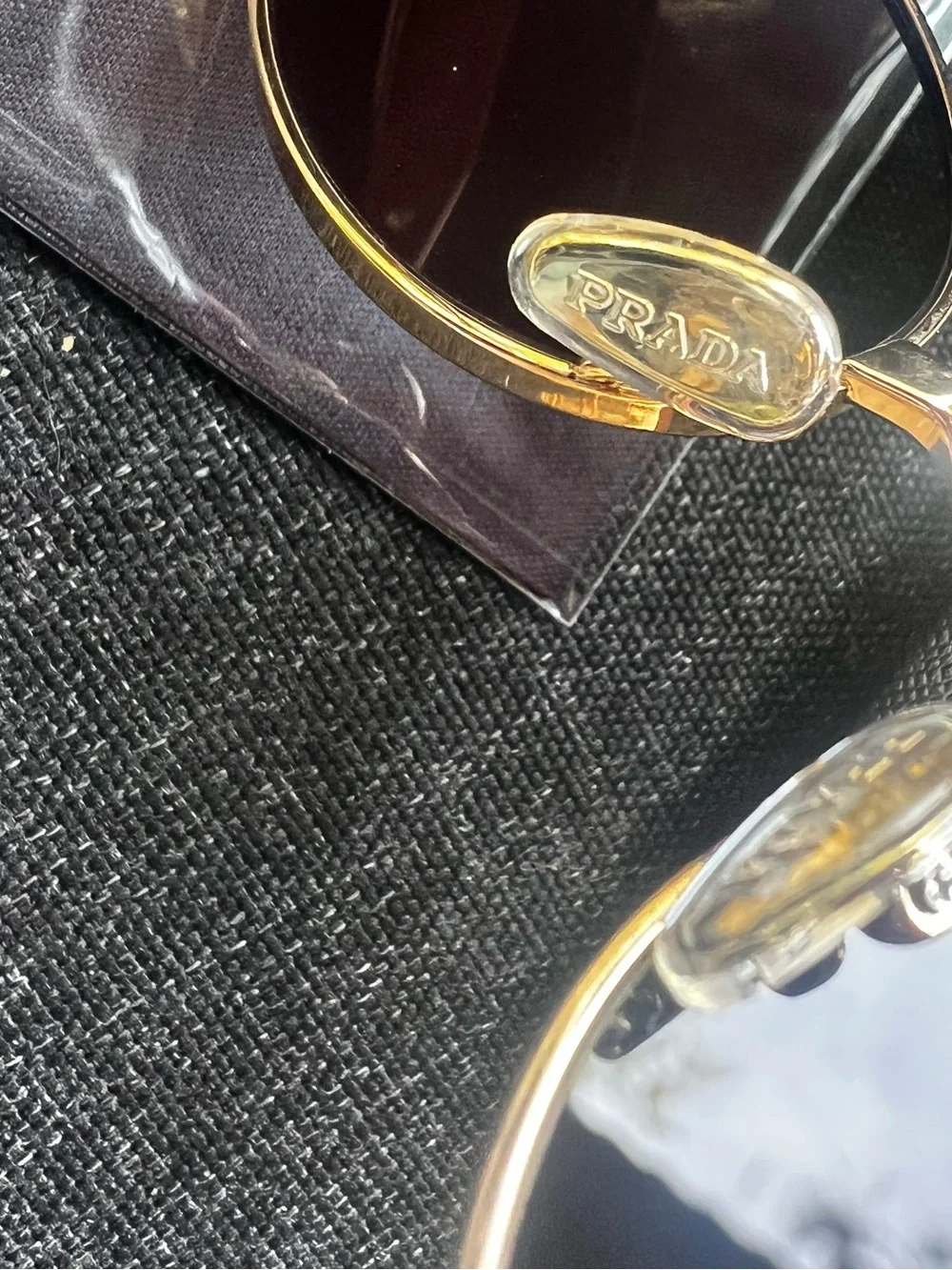 Prada Gold Frame Black Lens Round Sunglasses